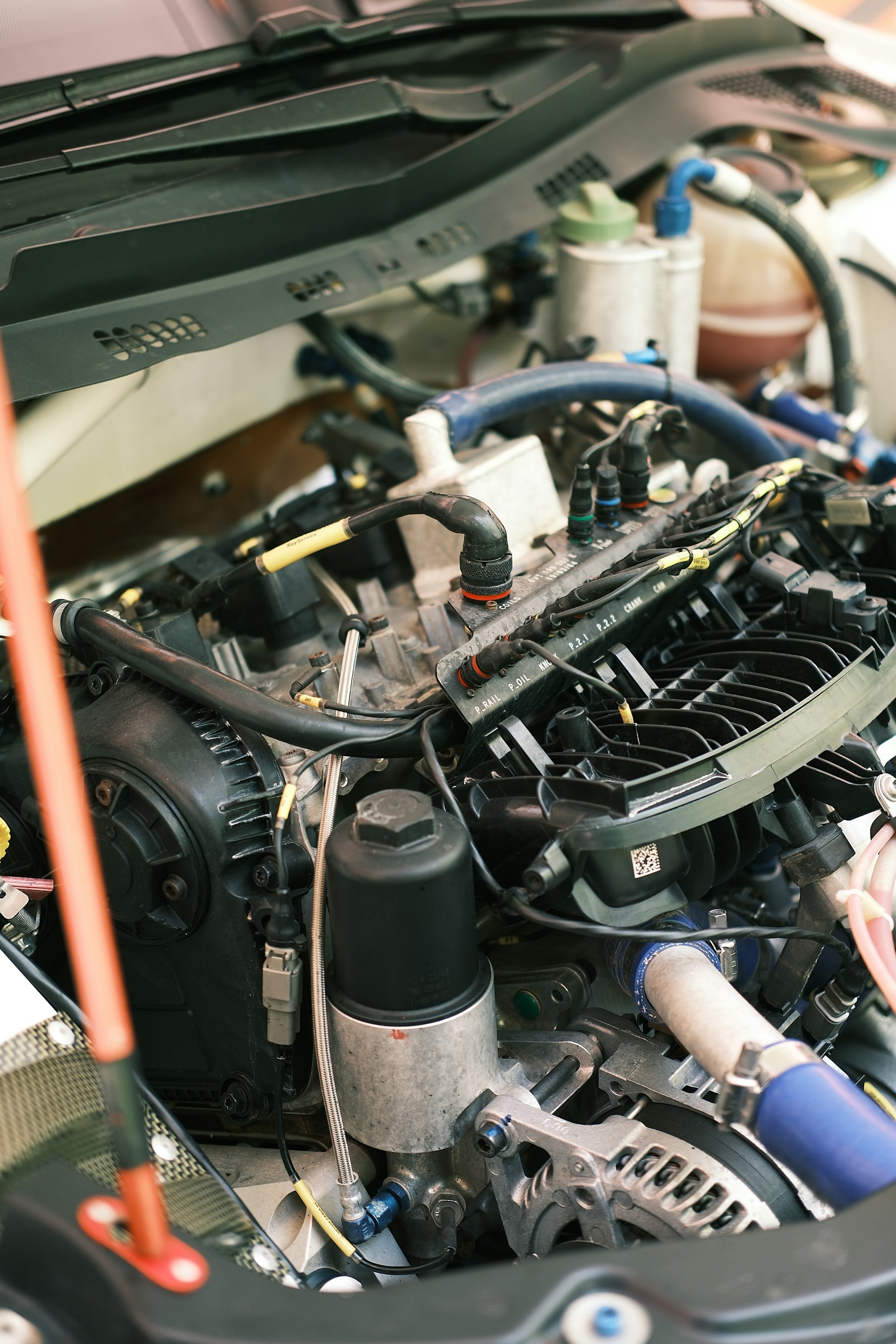 Transmission rebuild work in an open engine bay